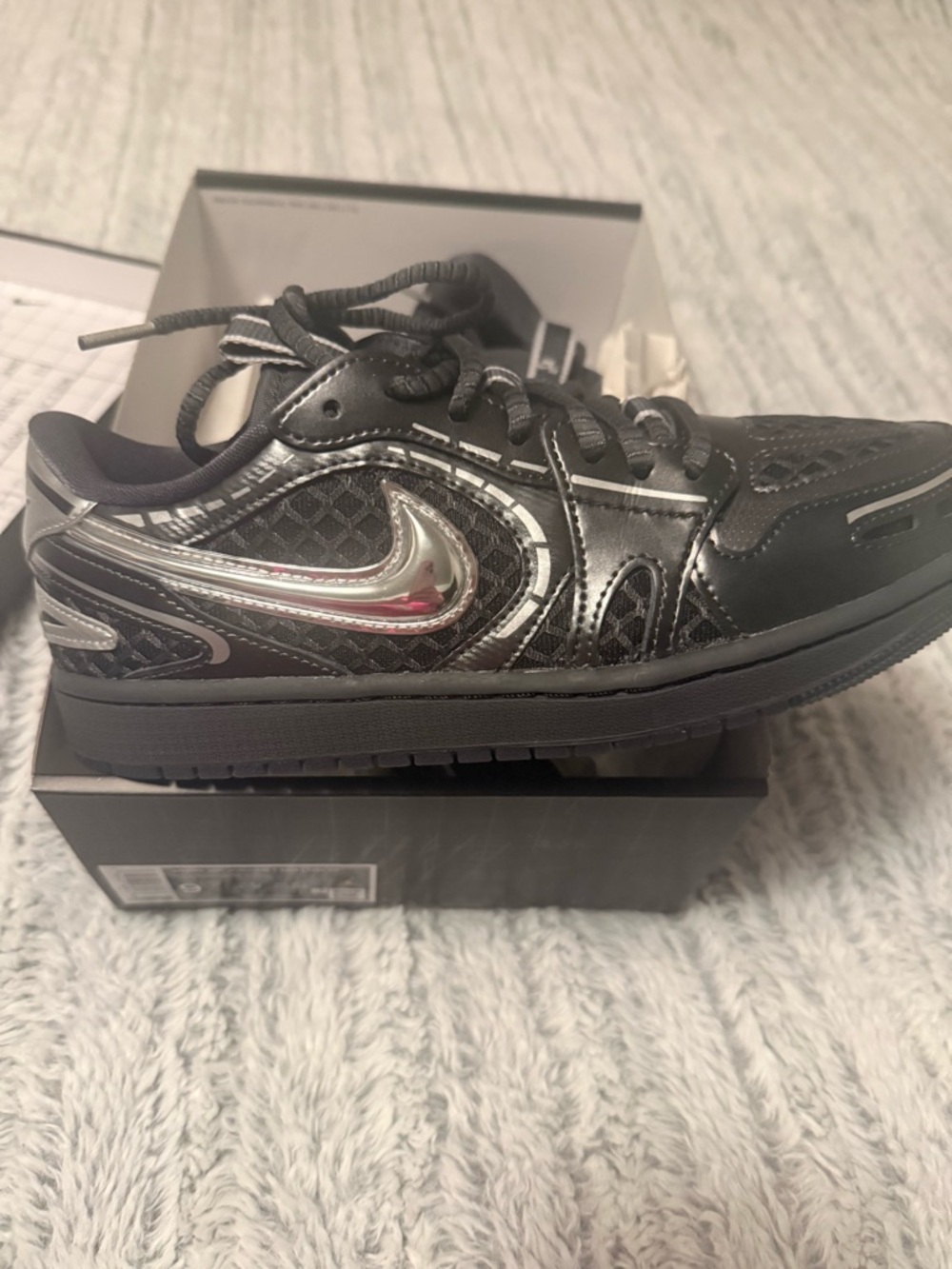 Nike Black with Metallic Silver Swoosh Low-Top Sneakers